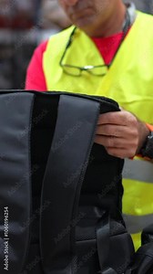 Man taking inventory using scanner to read barcode of products in a warehouse