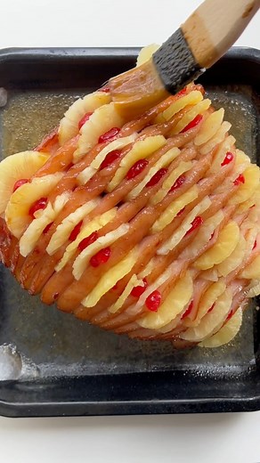 Move over hasselback potatoes, we're making a hasselback ham this Christmas! This epic show-stopper combies pineapple, ham and glacé cherries to create a sweet and sticky ham that will absolutely wow your guests. #christmasrecipes #glazedham #christmasham #christmasrecipe | Taste.com.au