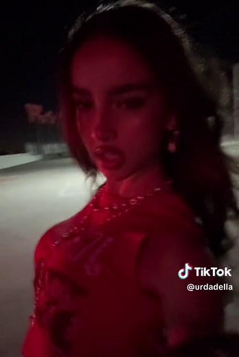 Dramatic Night Walk: Person in Red Top and Necklaces