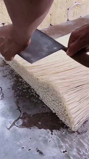 Slicing handmade noodles.