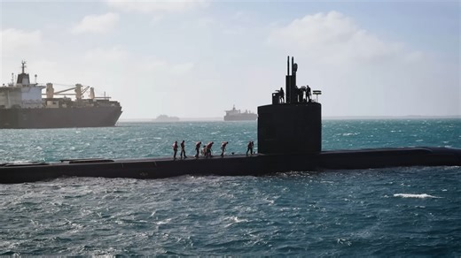 Watch this nuclear sub rise under a ship and tear it open