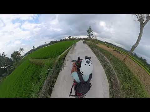 Riding in Lombok, Indonesia along the padi fields and meeting the locals.