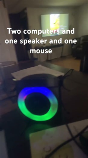 Two computer computers, and one speaker and one mouse