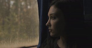 Sad Lonely Pensive Girl Riding Bus and Looking Out Window