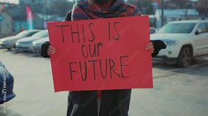 Hands man hold ecology poster This is our Future background cars city environment nature earth pollution world trash volunteer mask waste recycle garbage ecological slow motion