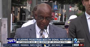 Flashing pedestrian signal beacon installed in Little Italy