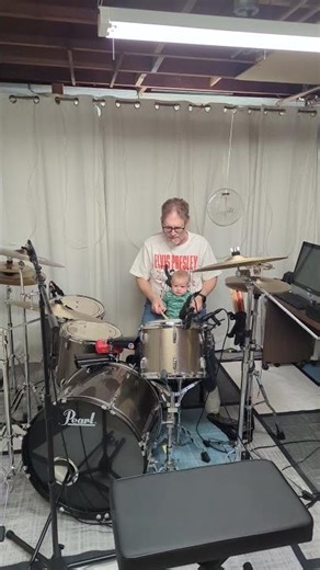 Diana's first drum lesson.