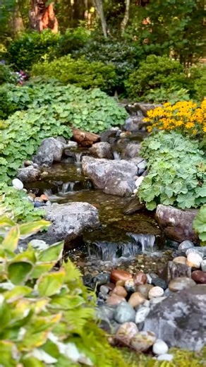 S T R E A M W O R K S D E S I G N S | This backyard waterfall looks so natural! 🌱💧 What do you think? 👇 #waterfeature #vancouver #waterfall #landscape #backyard | Instagram