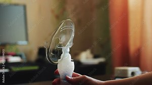 Mask for inhalation of the lungs. Treatment of respiratory diseases and asthma. Saline inhalation procedure.