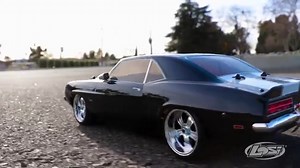 Losi 1969 Chevy Camaro V100 AWD This striking reproduction of the ’69 Chevrolet Camaro comes with a detailed body including a molded grill with bucket lights, fog lights, and rear lights as well as side view mirrors perfectly capturing the look and feel of this quintessential American muscle car. The V100-S chassis provides a balanced, neutral handling car with an emphasis on the locked rear differential. Its potent Dynamite® power system and shaft-driven 4WD delivers excellent traction on paved