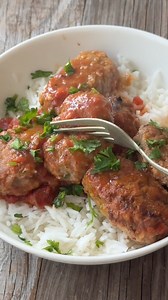Soutzoukakia, or Greek baked meatballs in tomato sauce, is a flavorful classic. Juicy meatballs simmered in a rich tomato sauce make for a perfect dish. Follow my tips to create the most tender meatballs! https://www.unicornsinthekitchen.com/soutzoukakia-greek-baked-meatballs-recipe/? | Unicorns in the Kitchen