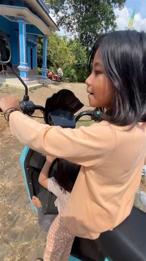 Casil and Qila ride electric bikes