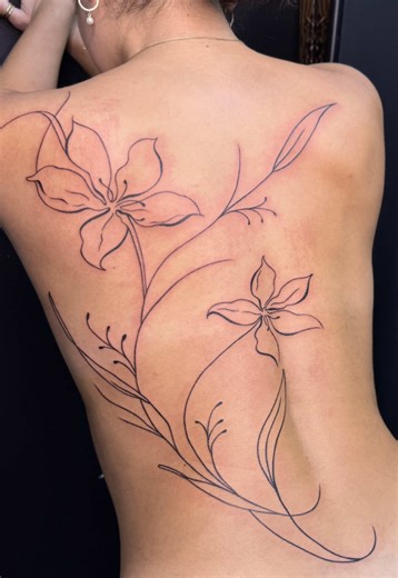 Full back tiger lily 🐅 🌸 dm on instragm to inquire! #fyp #backtattoo #floraltattoo #finelinetattoo #torontotattooartist