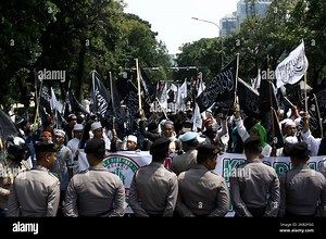 Indonesian Muslims carrying Tawheed flags and other attributes staged rallies in Jakarta, October 26, 2018. The demonstration was carried out following a viral video shows of burning flag bearing Tawheed (Laa Ilaha Illallah, There is no God but Allah, which is the core of Islamic teachings), in Garut, West Java. (Photo by Aditya Irawan/NurPhoto Stock Photo - Alamy