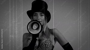 Young woman wearing black top hat and fishnets using megaphone
