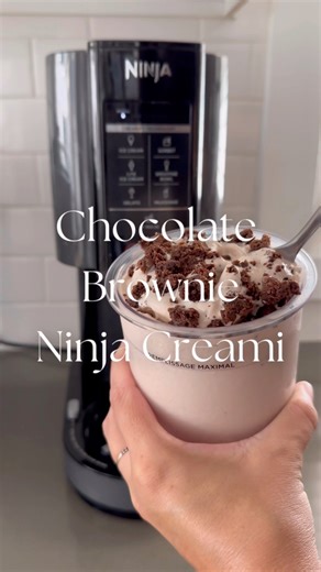 Chocolate Brownie Ninja Creami! I mix together 1 cup of whole milk, 1/2 cup Greek yogurt, 1 scoop or packet of chocolate brownie protein powder and this is optional but I added 1 tablespoon of chocolate syrup. Freeze overnight and then the Ninja Creami turns it into the best protein ice cream! I did add a brownie too as a mix in because WHY NOT?! This thing is magic 😋😮 | Jacqui Saldaña