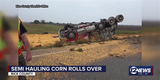 Semi hauling corn in Kansas rolls over
