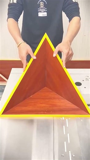 The formation of wood in a triangular shape which is assembled into a cone #shorts