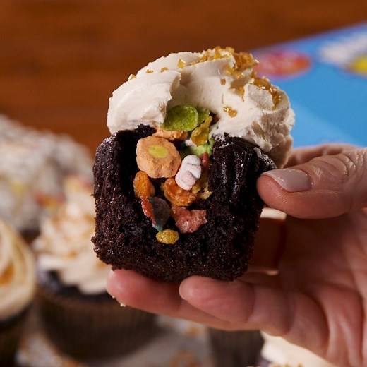 These chocolate cupcakes have the most delicious surprise center 🌈😋 #ad Full recipe: http://dlsh.it/aJ83DkI | Delish