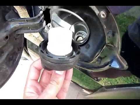 Locking Gas cap Removal How to! What a joke, The cap almost falls off!