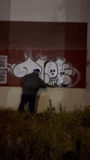 GRAFFTV on Instagram: "TLOKS TKO. Graff Legend Caught Mid-Act in Los Angeles. In an electrifying moment, the notorious TLOKS of the infamous TKO crew was caught on camera painting his signature moniker and trademark skull on a busy Los Angeles street. The footage, captured late at night, shows the LA graffiti legend in action, risking police detection to emblazon his iconic tag. Despite the constant threat of passing officers, the vandal managed to swiftly complete his work, before being detecte