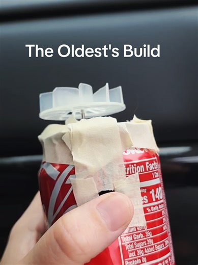 The oldest, 9 years old, sat down and built this from scratch and I’m still just watching it like… yeah, this is something different. Watching him work on this stopped me in my tracks, not because it’s a “kid project,” but because of how he approached it. He took a soda can and used it as the housing for a fan, which means he’s already thinking in terms of structure, airflow, and how to contain moving parts safely. Then he started fitting the components inside, adjusting spacing, rerouting wires