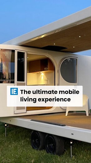 In its open position, the caravan provides an indoor-outdoor living arrangement with a sizable decking area where you can enjoy nature and two huge doors that open up to the covered living room. | Interesting Engineering