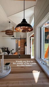 This single-level tiny home offers open, uncluttered living with a storage loft above in the living room / entry way. You’re greeted with large windows, an open layout, and an electric fireplace. The kitchen has a full-size oven, four-burner stove, large refrigerator, dishwasher, and a spacious sink beneath a window overlooking the forest. The primary bedroom feels expansive with large windows and a private entrance. There is a full size closet, and lots of storage around the bed itself. When yo