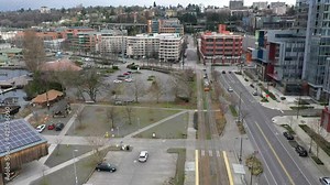 Cinematic bird's-eye shot of an electric streetcar near Westlake Park, Eastlake and Capitol Hill looking from South Lake Union in Seattle, Washington during the COVID-19 pandemic lockdown
