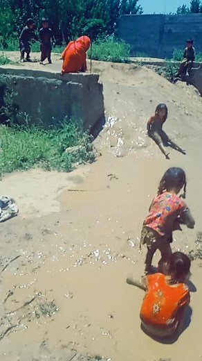 Children Playing in the Mud: Joyful Outdoor Activities