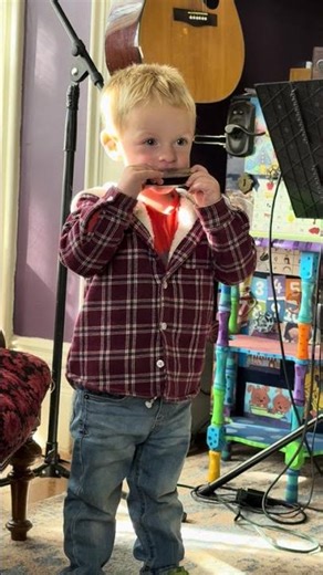 Our little pool guy in training is also a budding musician!