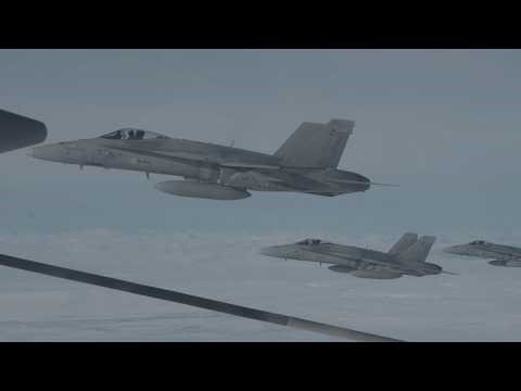 Marine KC-130J Super Hercules refuels Finnish Air Force F/A-18 Hornets