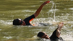 Parisians swim in the Seine to show it's safe before Olympics