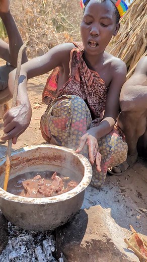 Hadzabe tribe Cooking Meat and eating their food.