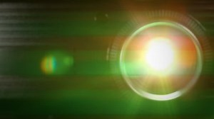 Digital film projector lens in action. Front view of digital film projector lens in action