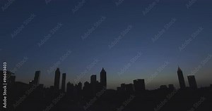 City Skyline Backlit Low with More Sky. the atlanta city skyline is backlit at dusk low in the shot with room for sky.