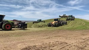 PMS on the wheatlage clamp with 11 foragers and 7 krone Big M 420 and 5 @macdon_industries_ltd Direct cutters then 50 lorriers and God knows how many tractors on the clamp all too supply feed to this 250,000 head dairy unit this clamp will hold 60,000 tonne and its the 2nd one since Monday #farmingphotographydaily #farmingphotos #farmingphotography | Farming Photography