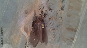 Landfill compactor bulldozer. Waste management, trash dump, pollution, recycling plant, trash landfill. Garbage dump. Drone aerial shot 4k.