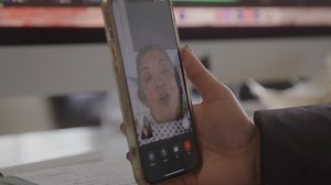 Closeup of Elderly Woman Talking with Family on Facetime From Hospital Bed