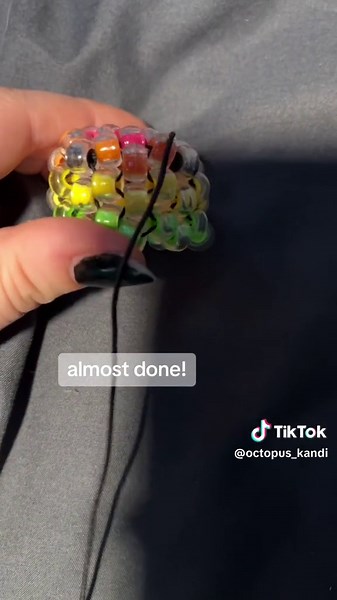 ive had this idea for a while but its tedious getting the perler beads inside the clear beads so i kept putting it off :’) #fyp#foryou#foryoupage#kandi#kandikid#ponybead#ponybeads#perlerbeads#perlerbead#octopus#kandioctopus#kanditutorial#kanditut#kandibracelet#kandicreations