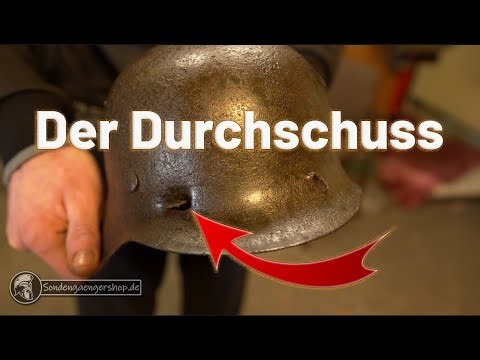 The bullet hole... Wehrmacht helmet with combat damage.
