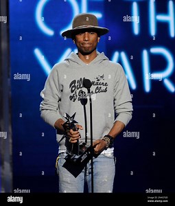 Pharrell Williams accepts the award for video of the year for “Happy” at the BET Awards at the Nokia Theatre on Sunday, June 29, 2014, in Los Angeles. (Photo by Chris Pizzello/Invision/AP Stock Photo - Alamy
