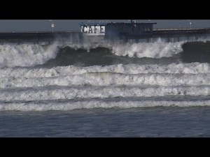 Huge 15-Foot Waves Rock Ocean Beach Surfers and Spectators