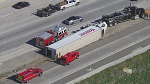 VIDEO: 2 big rigs flip on 15 Freeway amid strong Santa Ana winds
