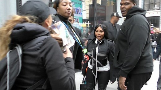 Lil' Kim Squares Up With Anti-Fur Protester in NYC