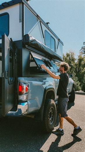 🏕️ “You won’t find hotels in the wilderness… and honestly, we prefer it that way.” Andrew’s 2020 Tacoma Hiatus build is designed to make the outdoors feel like home without losing the wild. Double barn doors and a side access entry keep the fresh air flowing. A slide-out bed sleeps two comfortably, while LED ceiling lights, a Maxxair fan, and exterior power ports make it just as functional off-grid as in town. Add Yakima racks for gear and a 270° Eezi-awn batwing awning for shade and shelter, a