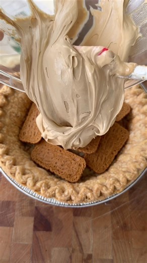 COOKIE BUTTER PIE 🔥🥧 Next time I would crush the cookies at the bottom. I love flaky crust and cookie crusts so thin layer of each I wanted to try. 😍 The filling is super addicting! Ingredients: -1 package (4 ounces) cream cheese, softened -1/2 cup creamy cookie spread -1/4 2tbsp cup confectioners’ sugar -1 cartons frozen whipped topping, thawed/ divided -1 Marie Calendar Pastry Pie Shell -caramel sundae syrup for drizzle -4 Biscoff cookies, crushed and more to layer for pie In a large bowl, 