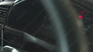 checking the engine speed on the instrument panel with a tachometer