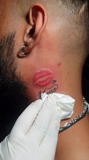 A kiss of ink, a touch of love! 💋✨ #manotattoo #trending #viral #rockinktattoolounge #foryou