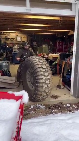 Massive custom motorcycle with oversized tyres, showing bold engineering and creativity